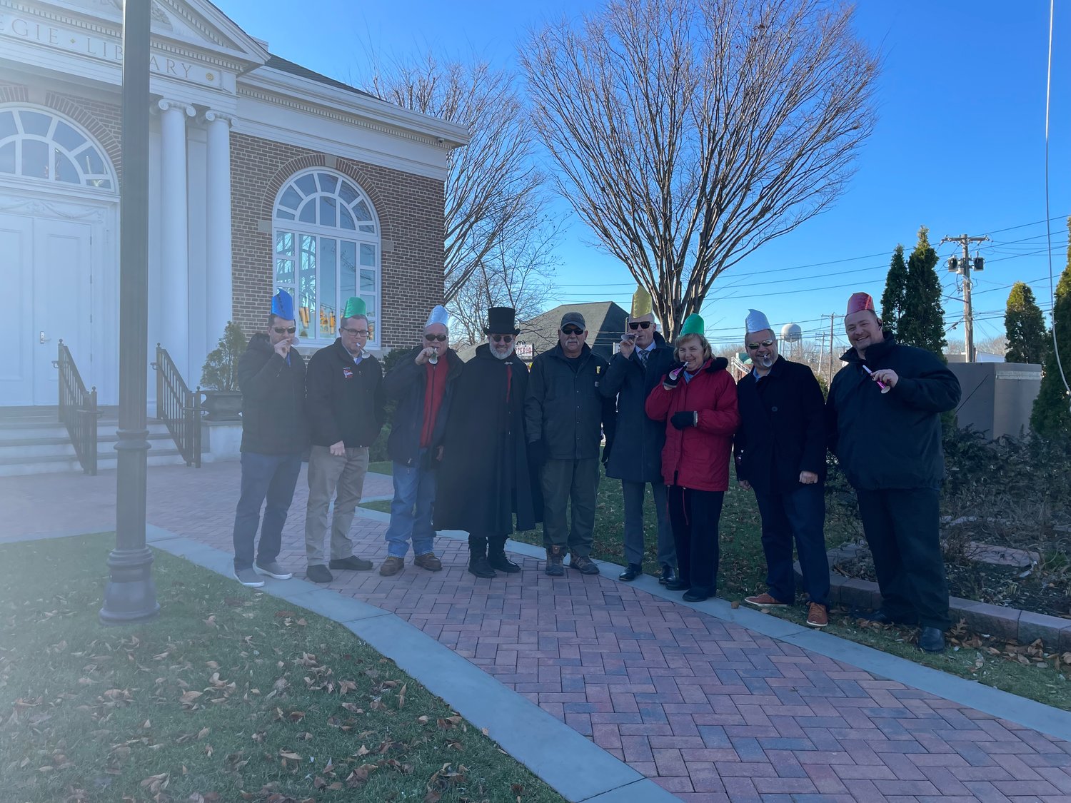 Pictured in front of the Carnegie Library at the intersection where the ball is set to rise on Main Street are the organizers of the event from left to right: Mike Cirigliano, Scott Cooper, Bill Hilton, Brian McAuliff, Al Puig, Gerry Crean, Lori Belmonte, David Kennedy, and Phil Fogarty.